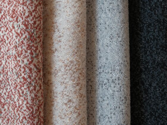 Close view of the Woolscape Mineral Red textile cover on the Beosound A9
