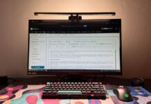BenQ ScreenBar Halo 2 Review: Dual-Sided Monitor Light Adds Adjustable Task and Bias Lighting BenQ ScreenBar Halo 2 monitor light mounted above a display