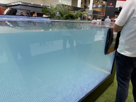 Roborock RockAqua P1 cleaning debris in a pool demonstration