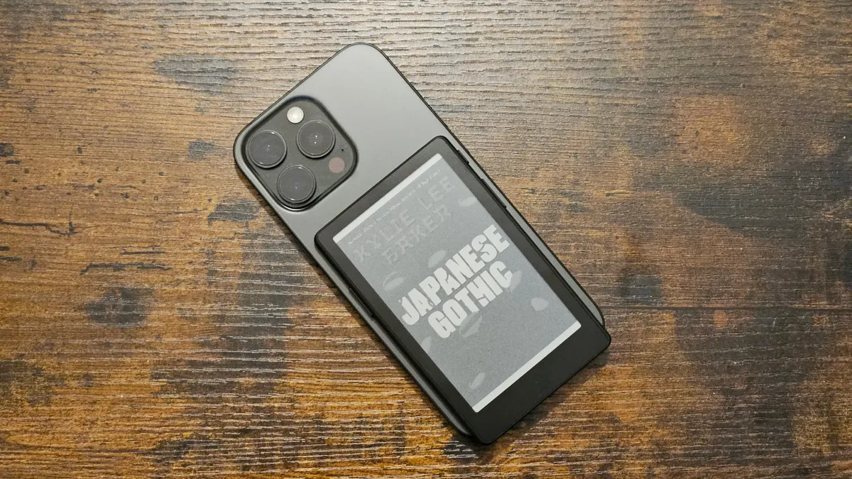 UGREEN Magic E Ink Screen Case for iPhone 18 Pro with a color photo displayed on the rear panel.