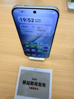 Rear view of a vivo X500 demo unit showing its off-center circular camera module