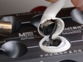 Apple AirPods 5 earbuds shown during a repairability teardown.