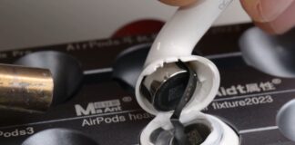 Apple AirPods 5 earbuds shown during a repairability teardown.