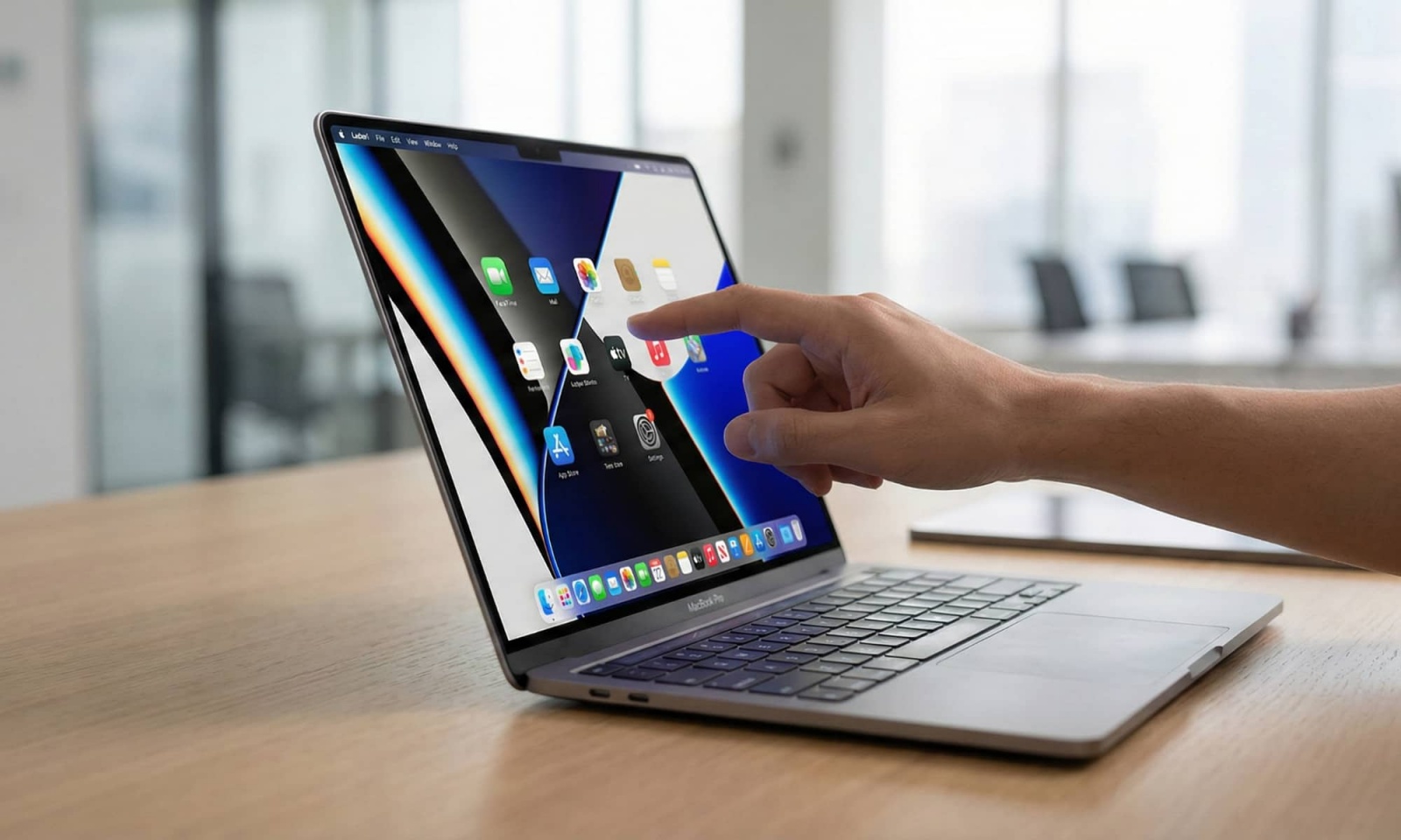 apple-macbook-pro-oled-cover-a97275-001 Apple MacBook Pro laptop shown open on a desk