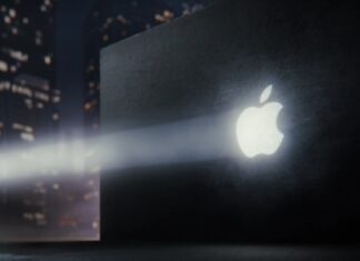 Apple Teaser Precedes Reported Touchscreen OLED MacBook Pro Reveal Apple logo projected on a dark wall with a nighttime city scene in the background
