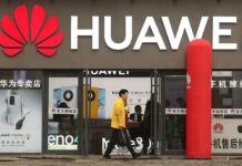 Huawei Put CNY 192.3 Billion Into R&D in 2025, More Than 21% of Revenue Huawei logo displayed on a building exterior