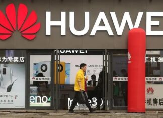 Huawei Put CNY 192.3 Billion Into R&D in 2025, More Than 21% of Revenue Huawei logo displayed on a building exterior