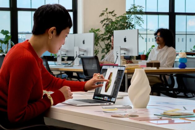 MacBook Pro shown with creative software on screen