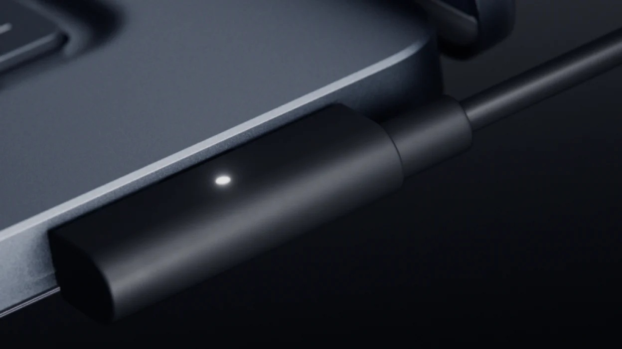 microsoft-magnetic-connect-surface-laptop-ultra-usb-c-cover-a97395-001 Microsoft Surface Laptop Ultra shown with its Magnetic Connect cable attached.